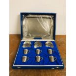 A Cased Set Of Six Pewter Cups and Saucers with Tray by Cristal, made in Brazil