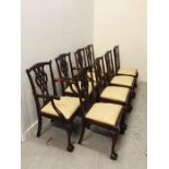 A Set of Eight Dining Chairs to Include Two Carvers with Calf Skin Cream Seats and ornately Carved