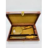 A Boxed set to include a magnifying glass and letter opener.