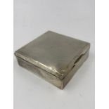 A silver cigarette box, hallmarked