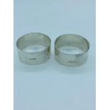 A pair of two silver napkin rings by Nathan & Hayes, Chester 1915