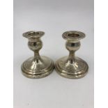 A Pair of silver candlesticks