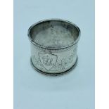A silver napkin ring, Sheffield 1880 Martin, Hall & Co.