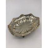 A four footed pierced silver bowl, hallmarked