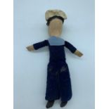 A Vintage sailor doll.