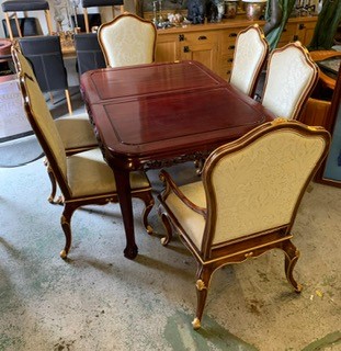 An Oriental cherry wood Dining room table with six chairs and two carvers