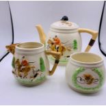 A Keele Street Pottery Hunting themed tea set to include teapot, sugar bowl and milk jug.