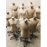 A Selection of twelve branded linen mannequins on adjustable brushed steel bases with wheels to