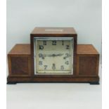 A 1930's walnut mantle clock from Harrods Ltd