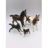 A selection of four Beswick Horses