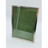 A rectangular silver picture frame