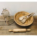 Large wooden salad bowl with servers, vintage rolling pin and two decorative glass carafes