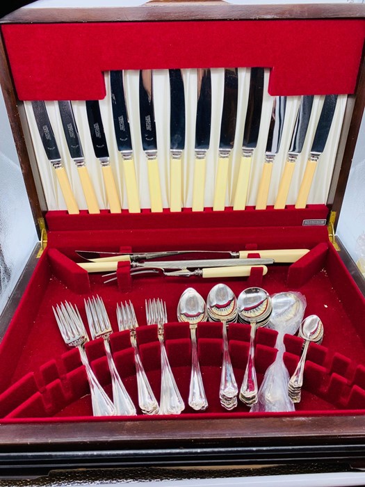 A cased six place setting of Garrard cutlery.