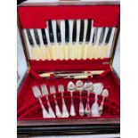 A cased six place setting of Garrard cutlery.