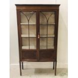 A Glazed mahogany display cabinet with inlay detail with two doors and three shelves