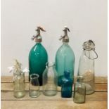 A Selection of vintage glass bottles to include two soda syphons