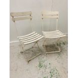 A Pair of wooden and metal folding garden chairs