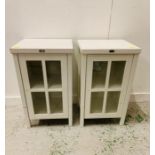 A Pair of white glazed cupboards