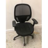 Black mesh office chair with lumber support and swivel base