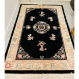 A Kayam oriental theme rug 100% wool, black, cream and pink (2.74m x 1.83m)