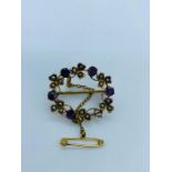 A Victorian yellow gold amethyst and seed pearl brooch