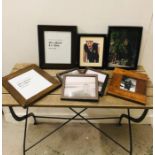 An assortment of eight wooden photo frames