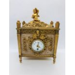 A French Gilt and marble clock with enamel face.