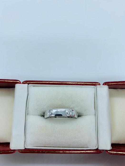 An 18ct white gold diamond set cartier style "LOVE" ring