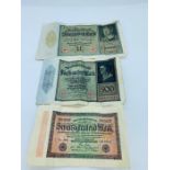 A selection of three German banknotes.
