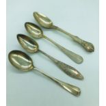 A selection of four silver teaspoons.