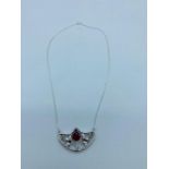 A Silver and rubellite pendant necklace on silver chain in the art nouveau style