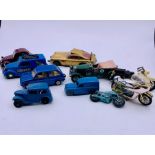 A small selection of diecast cars and motorbikes