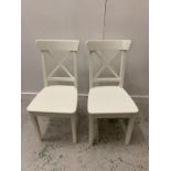 Pair of white wooden chairs with cross back
