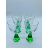 A set of six ovoid glasses with green bases