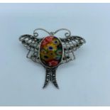 A silver and marcasite dragon fly brooch with millefiori style body