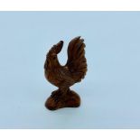 A Boxwood Japanese netsuke in the form of a rooster signed to the base