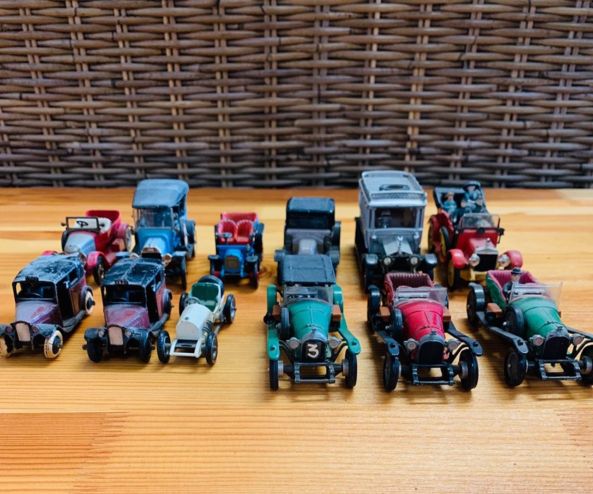 Twelve Corgi diecast cars