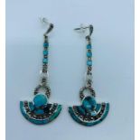 A Pair of silver art deco style drop earrings set with turquoise and marcasite