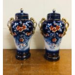 A Pair of early 20th century two handled lidded pottery vases AF