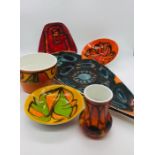 A selection of seven pieces of Poole Pottery various styles and shapes.