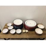 A Selection of Lexington dinnerware in blue, green and red trim to include 9 dinner plates, 7