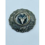 A Simba brooch REG 130/59 with a deer theme.