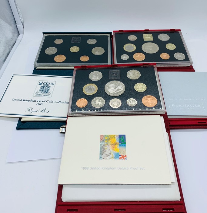 Three United Kingdom Proof Sets for 1985, 1998 and 1999.