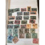 A stamp album containing amongst others stamps from Congo, Burkina Faso, Cameroon and Egypt