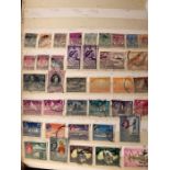 A worldwide stamp album to include amongst others Singapore, Malaysia, Mauritius, Montserrat,