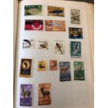 A Worldwide Album of stamps to include Northern Rhodesia, New Zealand, Malta, Mauritius, Matal,