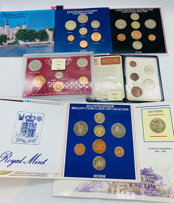 A selection of UK coin packs to include: 1983 UK Uncirculated Coin Pack, 1984 UK Brilliant