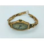 A Ladies 9ct gold watch in an art deco style (15.4g)