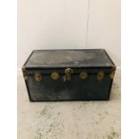 A Large metal travel trunk with decorative brass trimmings and leather handles (H50cm D50cm W103cm)