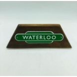 An Enamel " Waterloo" sign on wooden plaque